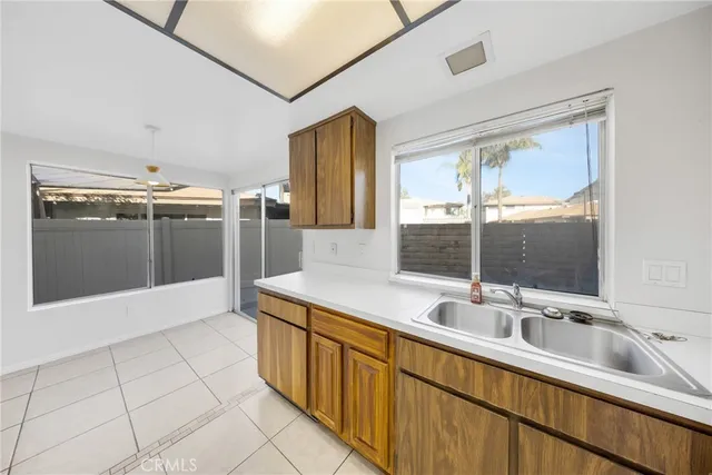 a bathroom with a double vanity sink a mirror and a shower