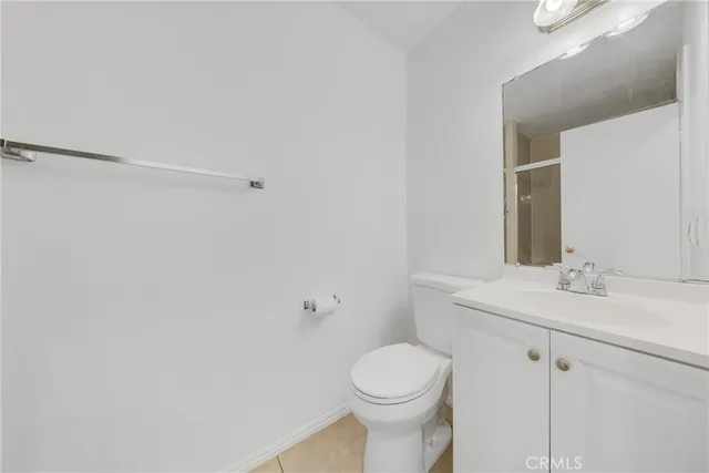 a bathroom with a sink a toilet and vanity