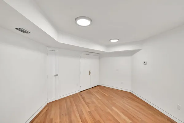 a large kitchen with kitchen island a stove a center island sink and a refrigerator