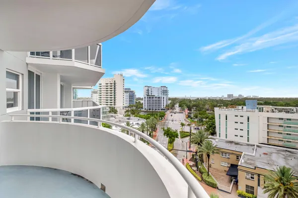 a kitchen with stainless steel appliances a sink and a refrigerator