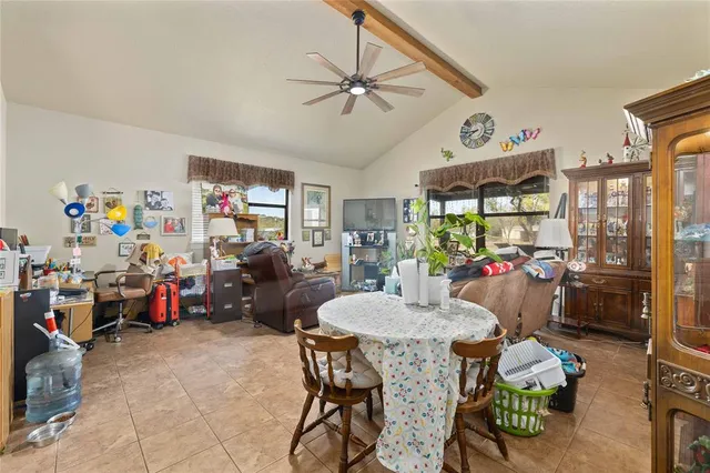 a living room with lots of furniture and a chandelier