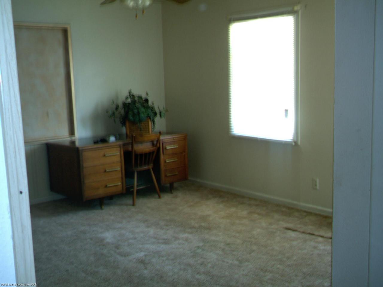 4608 South Hughes Street Amarillo, TX 79110 - Photo 3 of 3 a room with a window