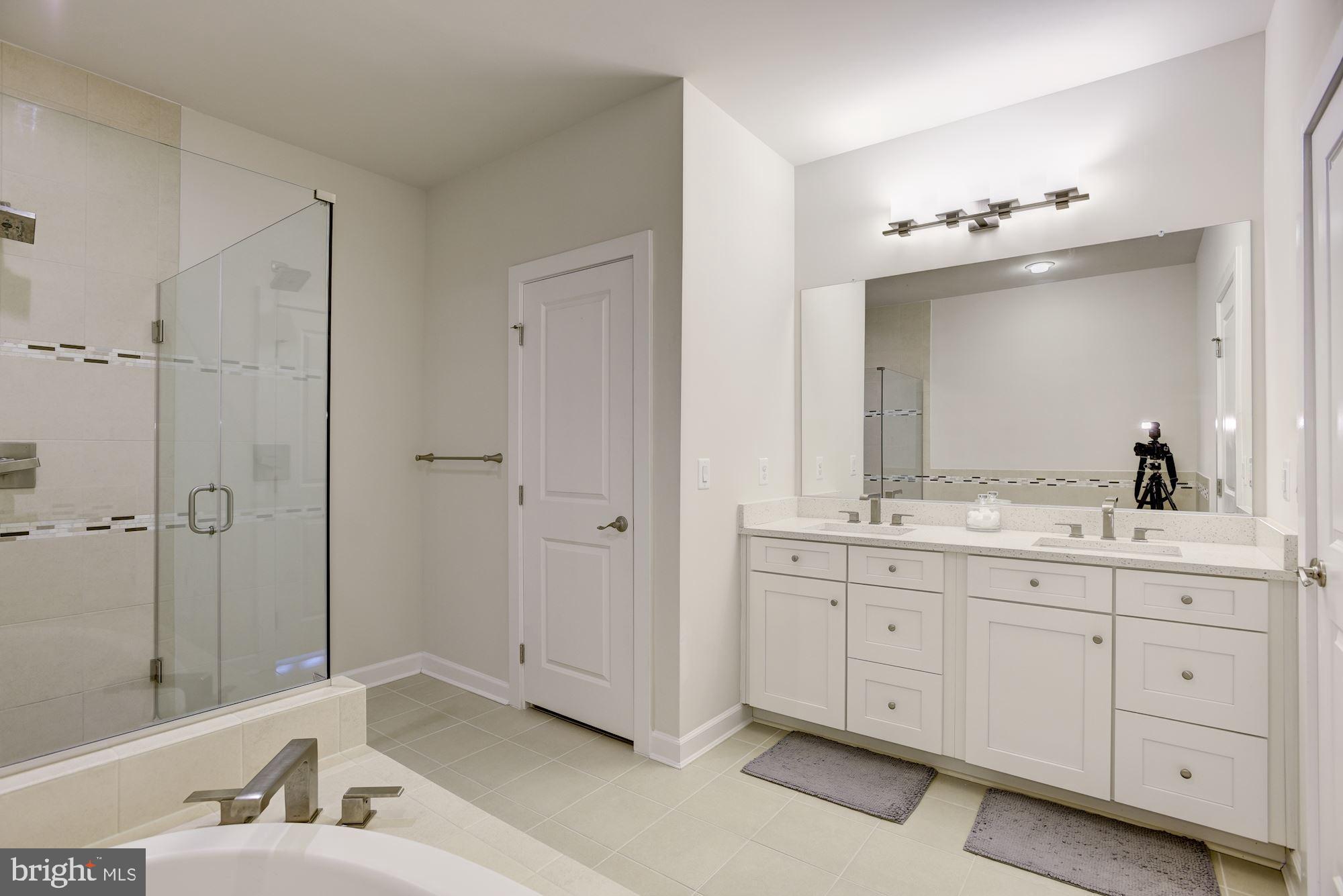 1513 Ribbon Limestone Terrace Southeast Leesburg, VA 20175 - Photo 16 of 27 Spa like master bath with frameless shower