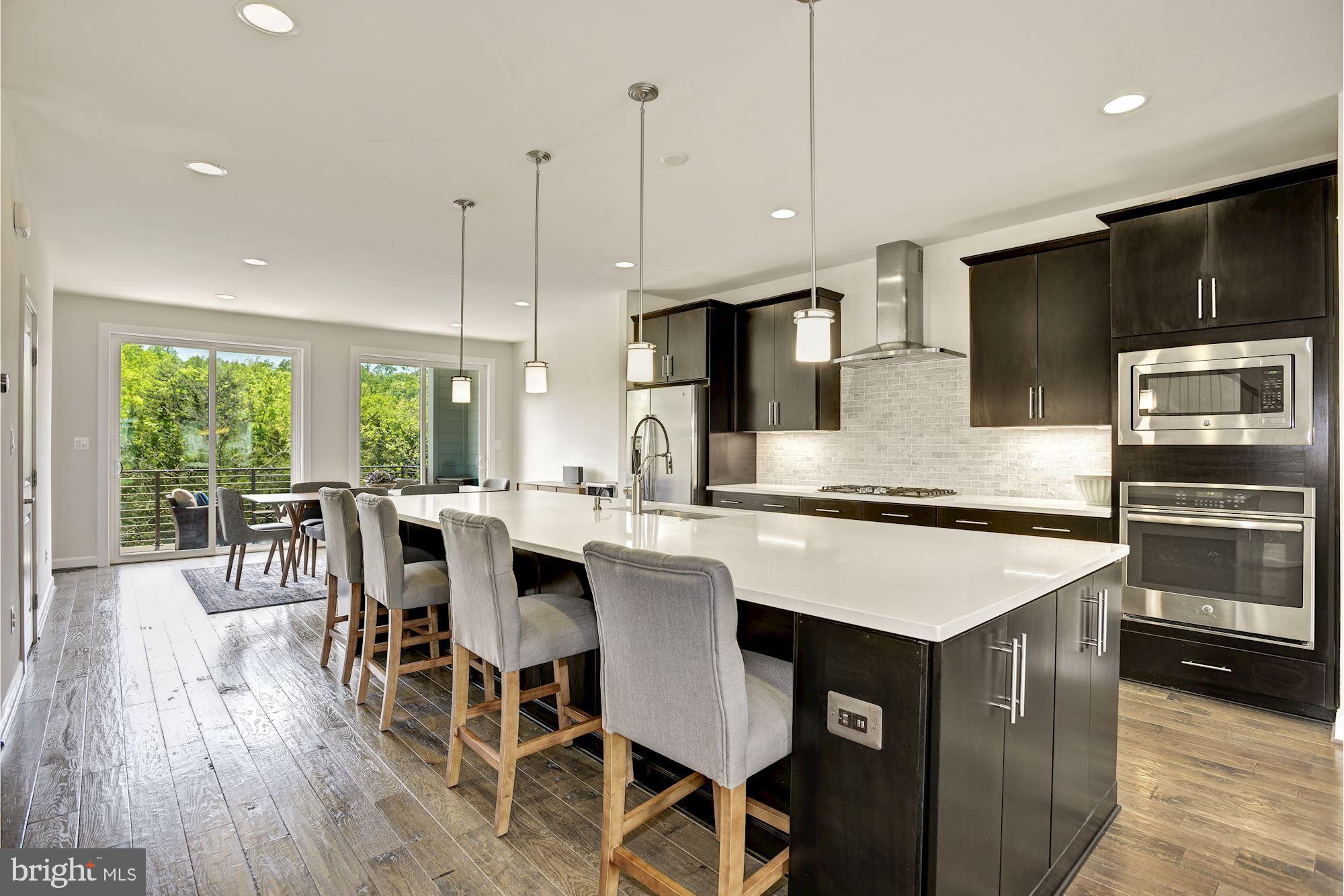 1513 Ribbon Limestone Terrace Southeast Leesburg, VA 20175 - Photo 6 of 27 Kitchen with trendy hood and backsplash