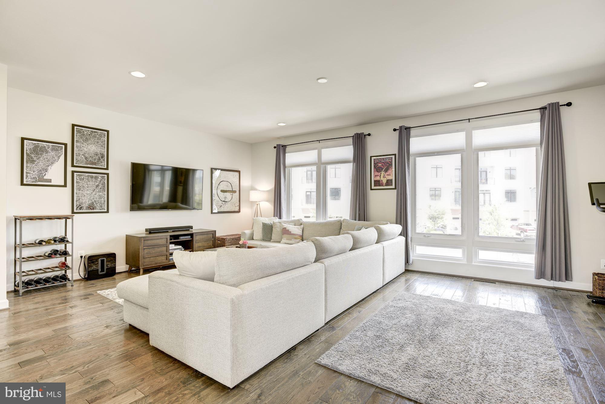 1513 Ribbon Limestone Terrace Southeast Leesburg, VA 20175 - Photo 7 of 27 Living Room with floor to ceiling windows