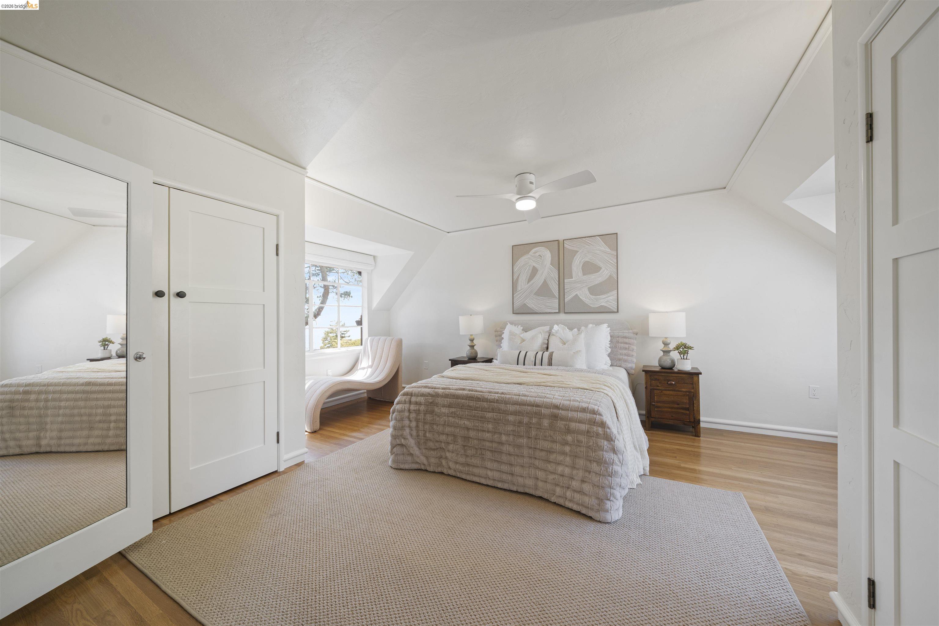 1170 Sterling Avenue Berkeley, CA 94708 - Photo 25 of 52 Bedroom with lofted ceiling, light wood-type flooring, a ceiling fan, and a closet