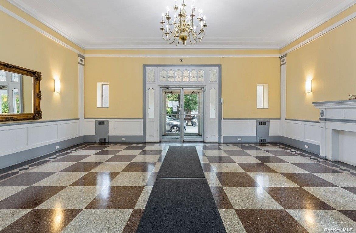 65-38 Booth Street, Unit 2F Queens, NY 11374 - Photo 3 of 13 a view of a entryway with a rug