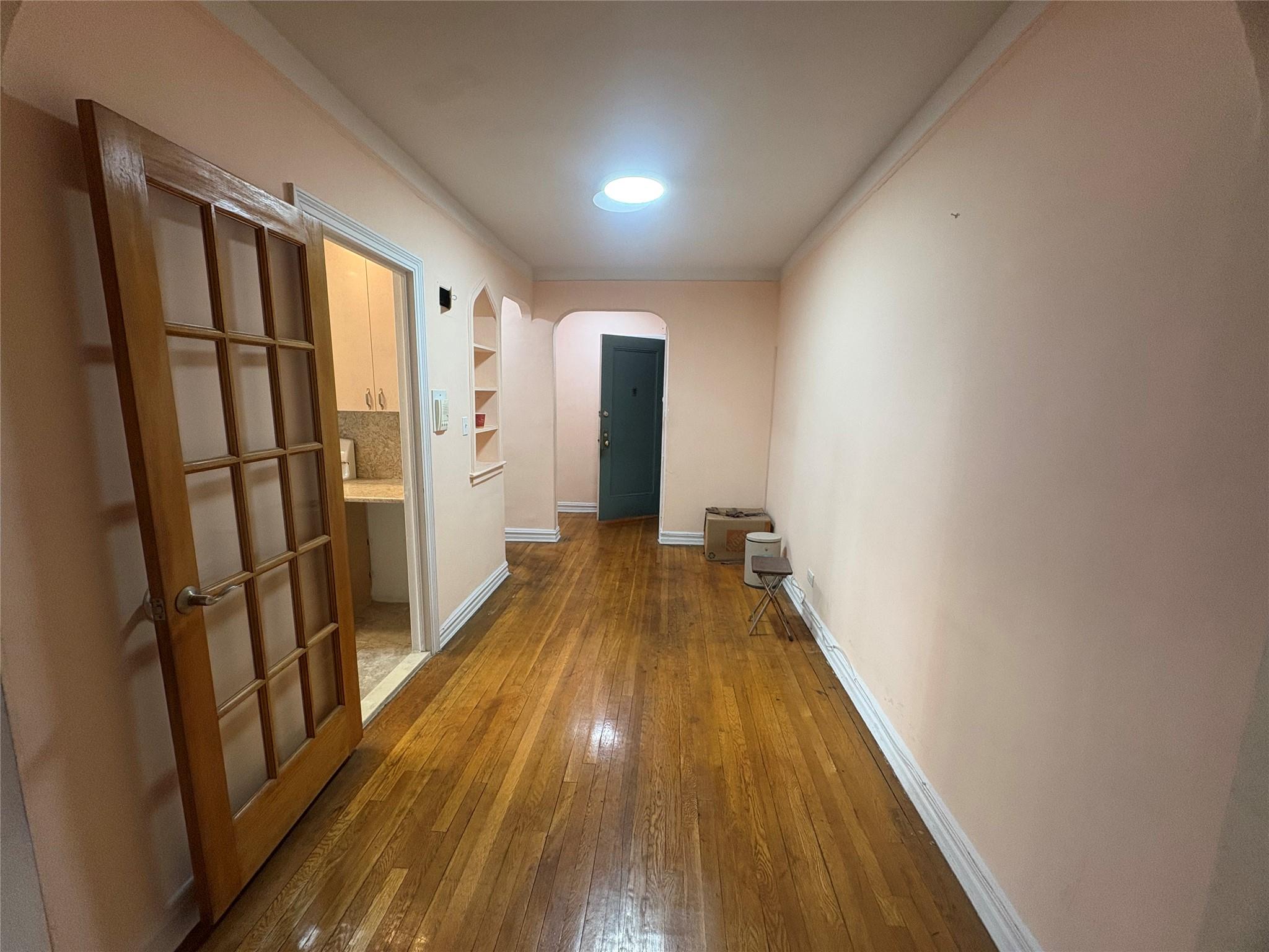 65-38 Booth Street, Unit 2F Queens, NY 11374 - Photo 9 of 13 a view of gallery with wooden floor