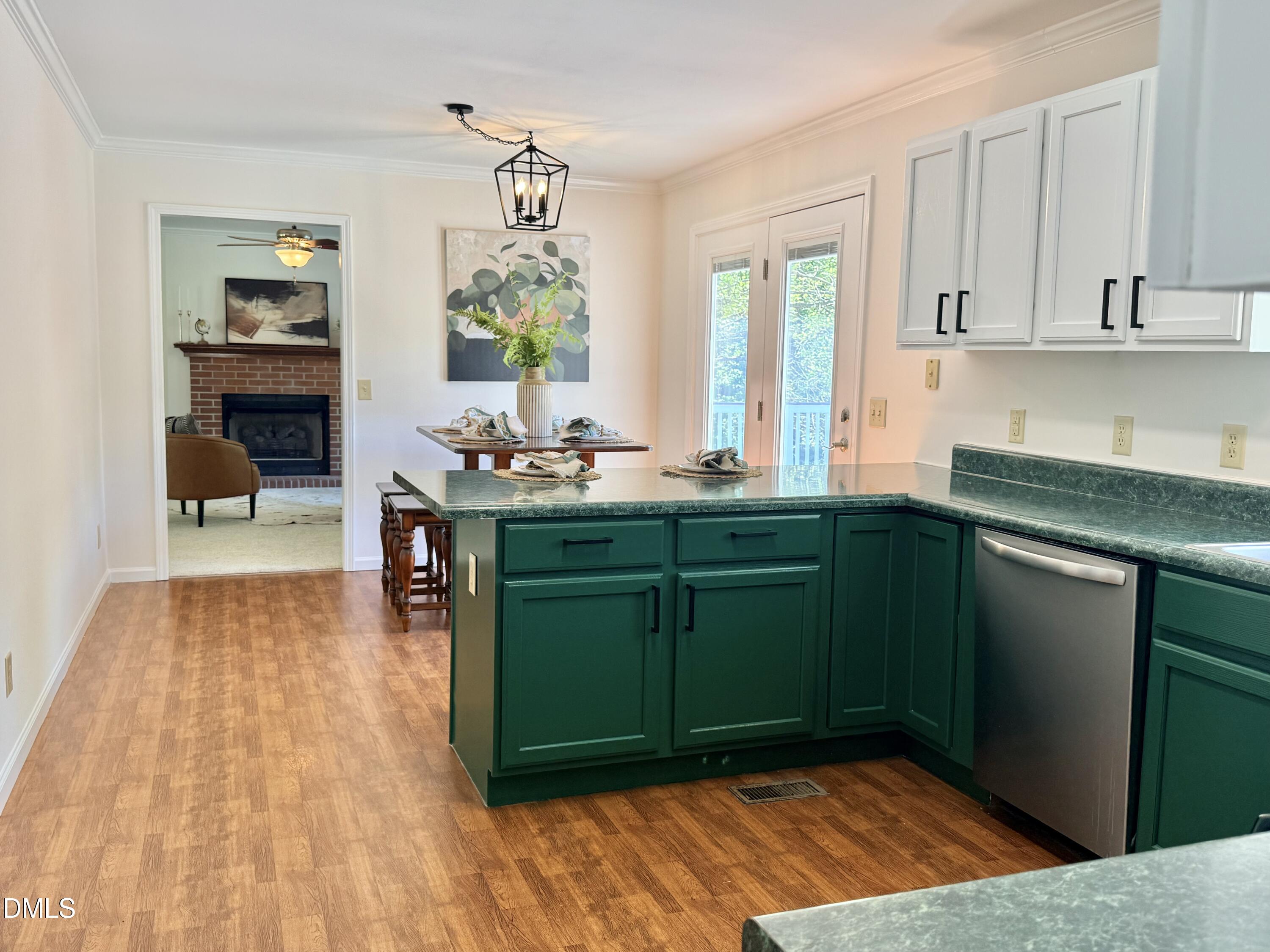 2429 Halifax Road Roxboro, NC 27573 - Photo 21 of 54 a kitchen with a sink and cabinets
