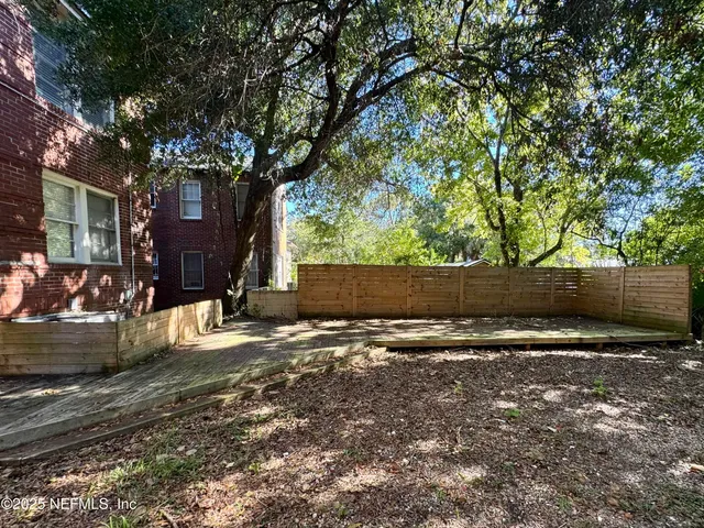 a backyard of a house with lots of green space