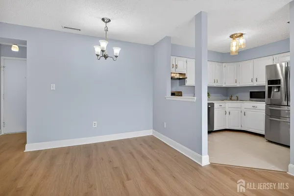 a view of cabinets and wooden floor