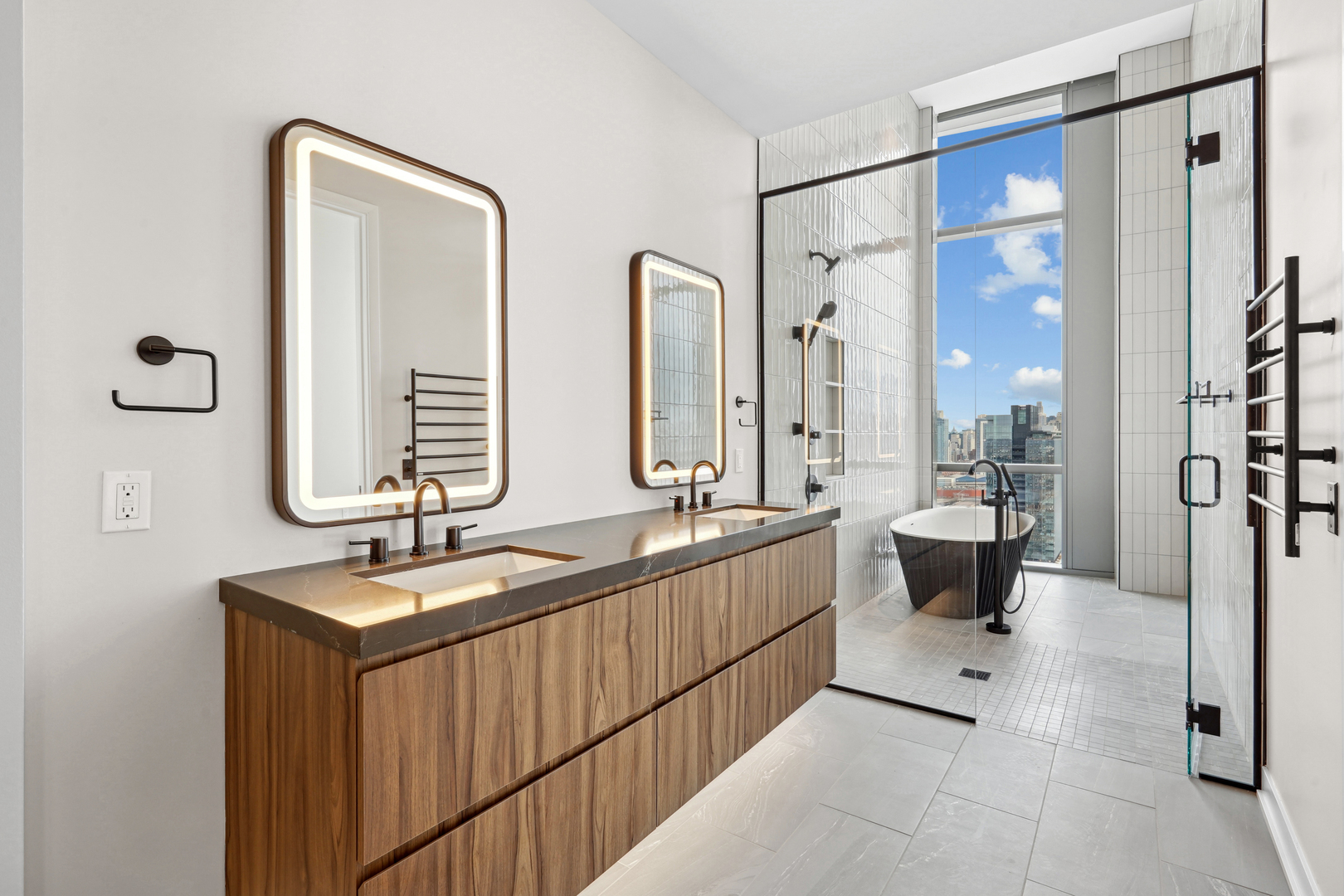 1114 West Carroll Avenue, Unit 3203 Chicago, IL 60607 - Photo 13 of 36 a bathroom with double vanity sinks a mirror and a shower