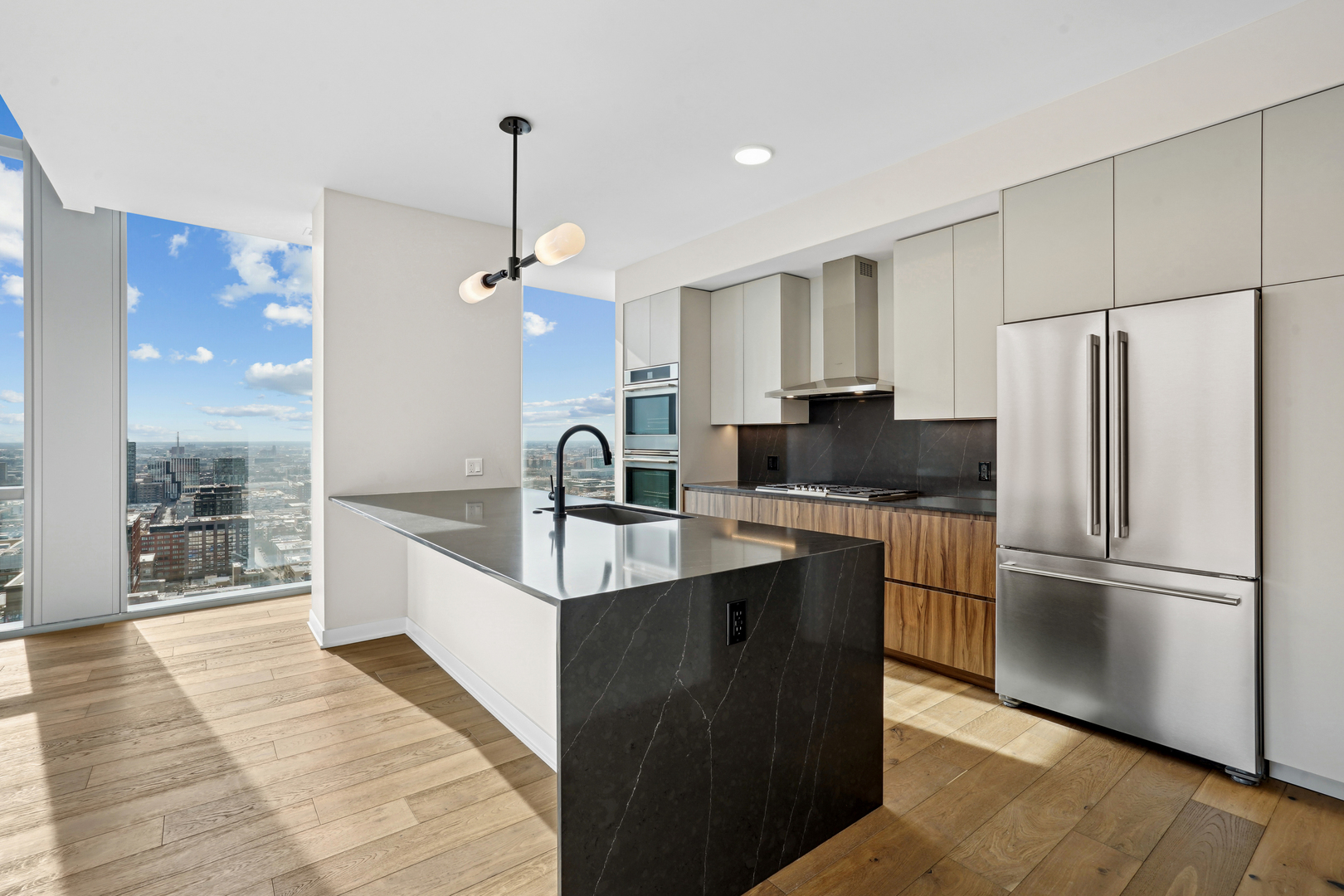 1114 West Carroll Avenue, Unit 3203 Chicago, IL 60607 - Photo 2 of 36 a kitchen with stainless steel appliances granite countertop a refrigerator a sink and a stove