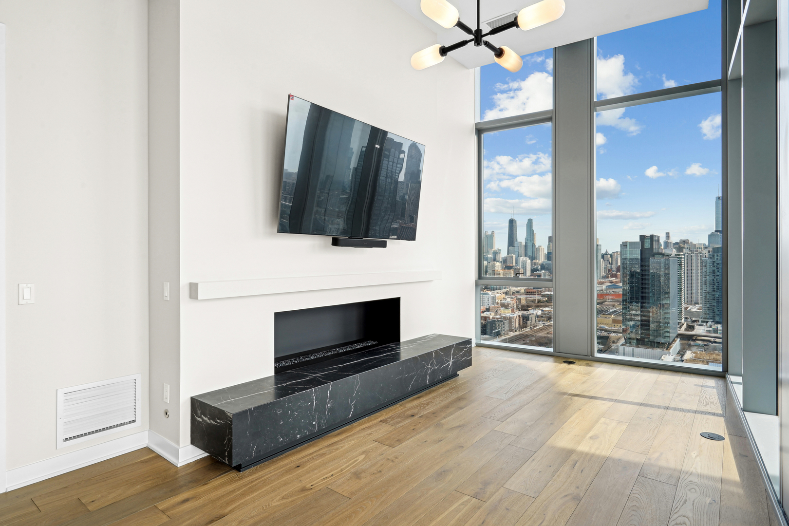1114 West Carroll Avenue, Unit 3203 Chicago, IL 60607 - Photo 9 of 36 a living room with furniture fireplace and flat screen tv