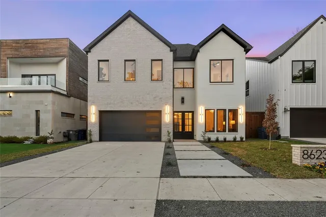 a front view of a house with yard
