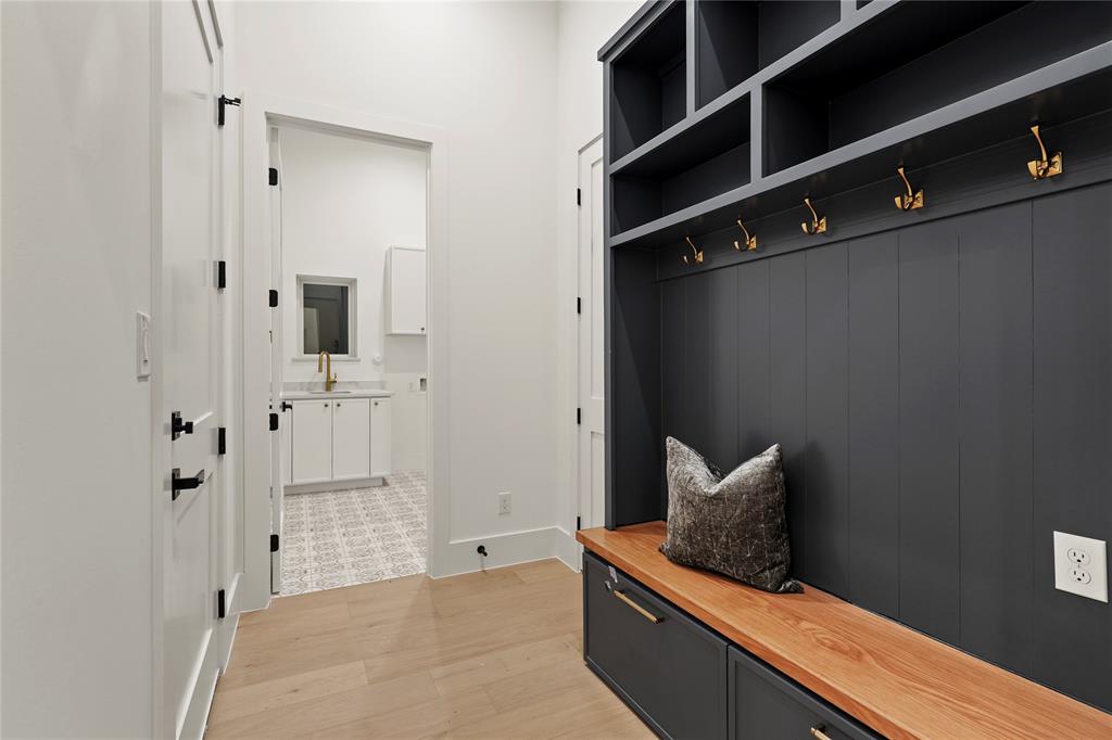 8623 San Fernando Way Dallas, TX 75218 - Photo 13 of 40 a hallway with cabinets