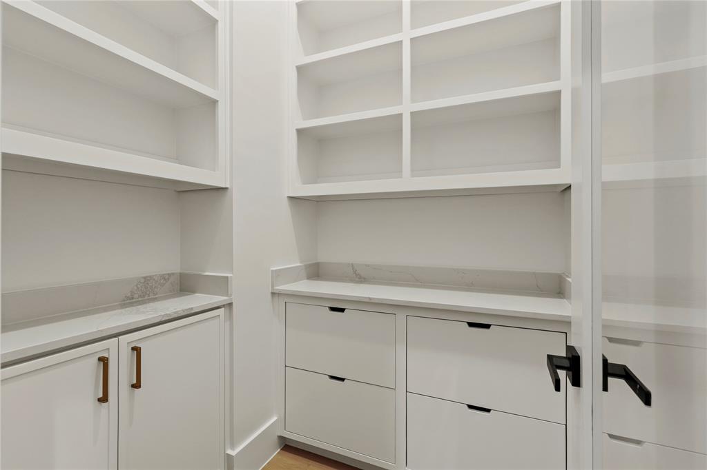 8623 San Fernando Way Dallas, TX 75218 - Photo 21 of 40 a utility room with cabinets