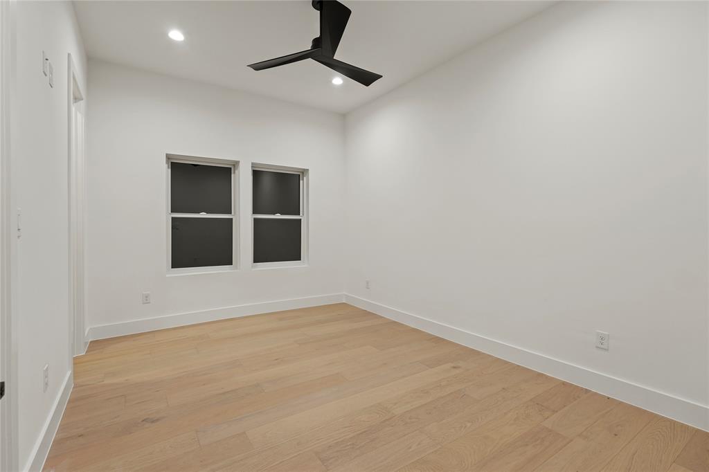8623 San Fernando Way Dallas, TX 75218 - Photo 29 of 40 an empty room with ceiling fan and windows