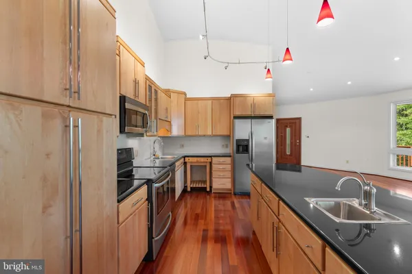 a kitchen with a sink and cabinets