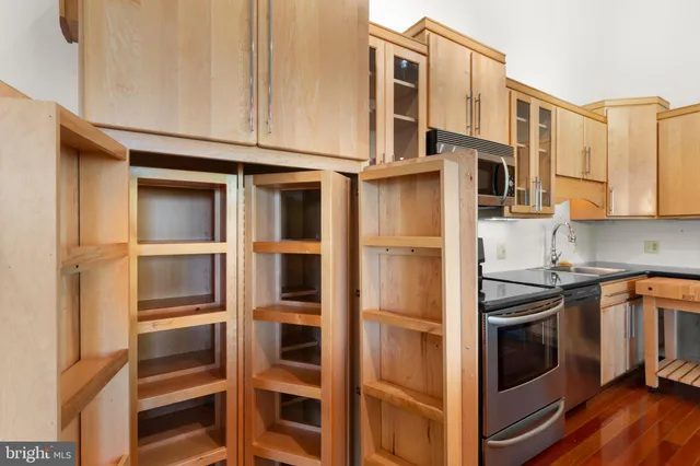 a view of room with hardwood floor and window