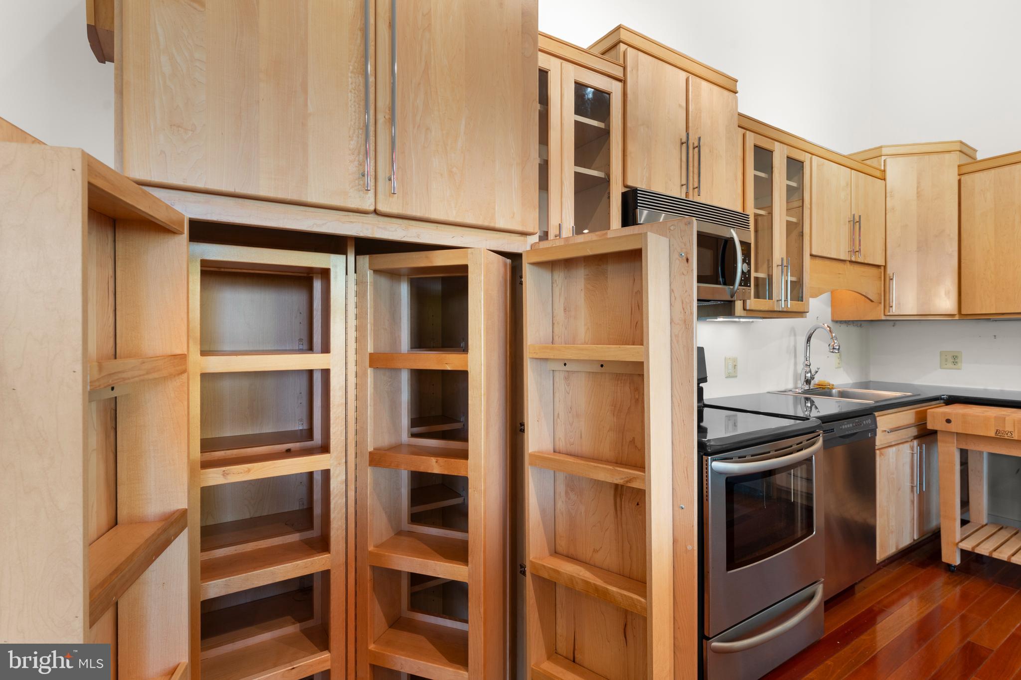243 Aaron Mountain Road Castleton, VA 22716 - Photo 22 of 58 a kitchen with stainless steel appliances granite countertop a stove and a refrigerator