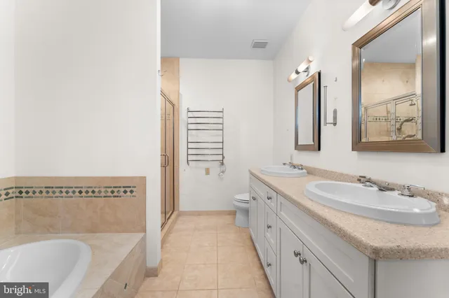 a view of a livingroom with wooden floor and a ceiling fan