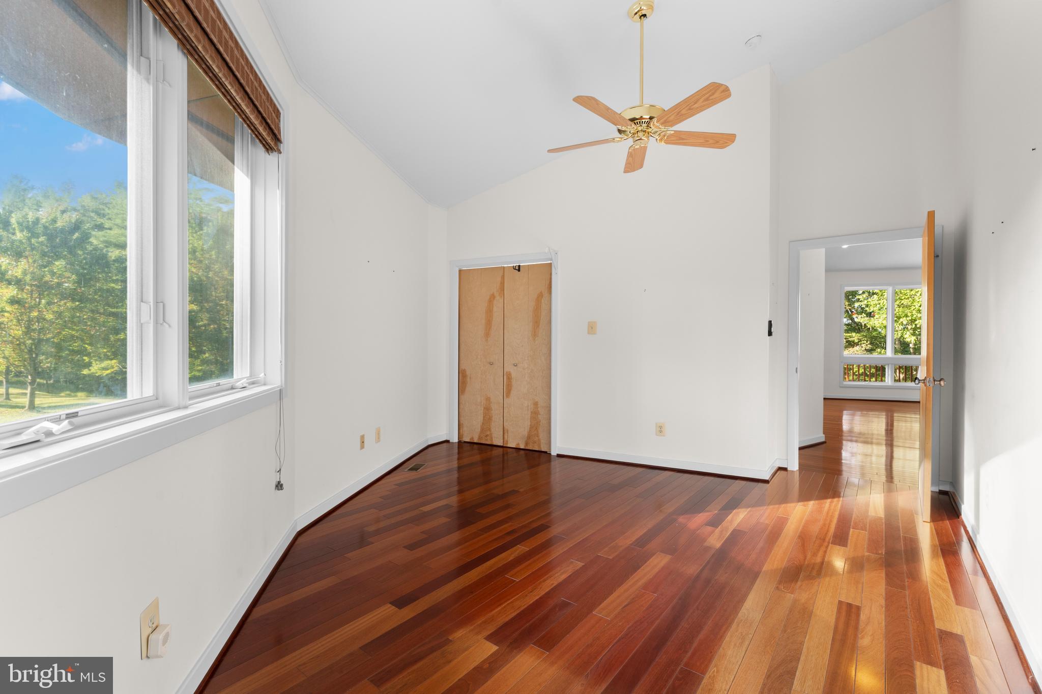 243 Aaron Mountain Road Castleton, VA 22716 - Photo 34 of 58 a view of a livingroom with wooden floor and a ceiling fan