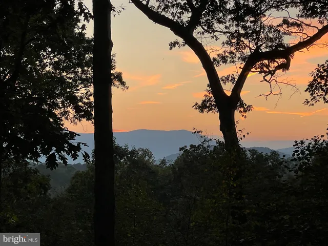 a view of mountain view with lots of trees
