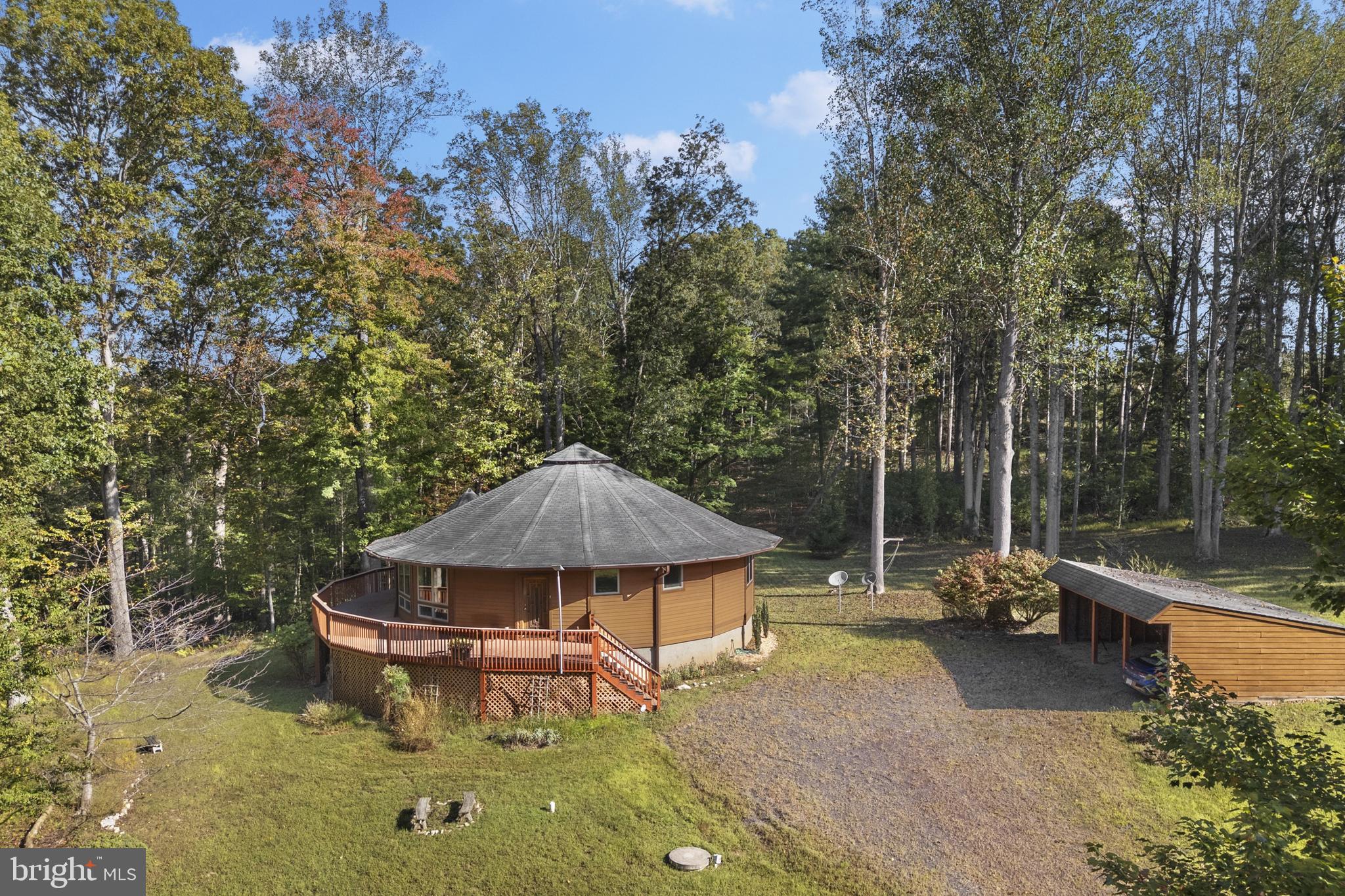 243 Aaron Mountain Road Castleton, VA 22716 - Photo 43 of 58 a backyard of a house with table and chairs