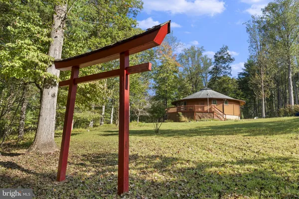 a view of a backyard with sitting area