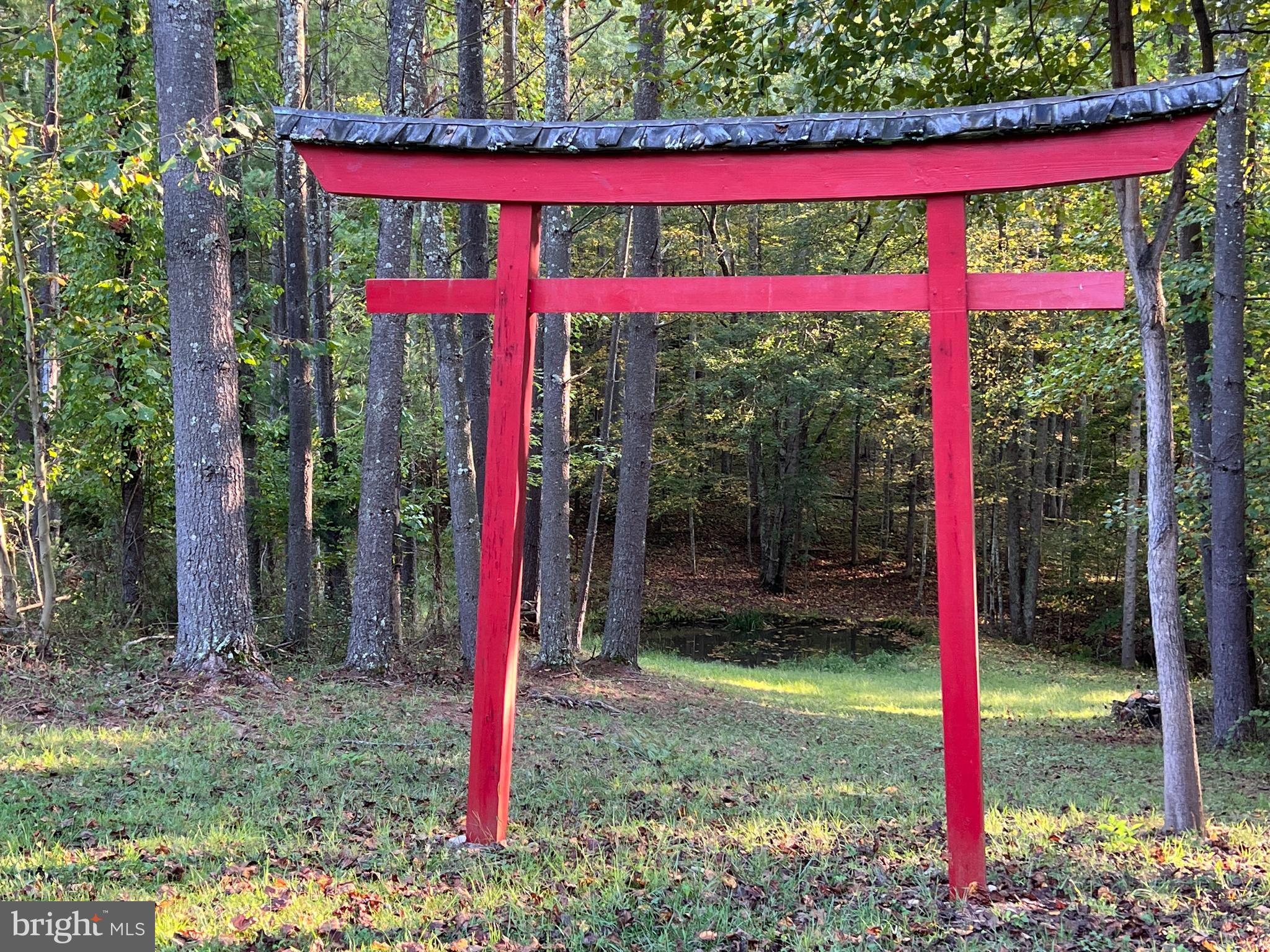 243 Aaron Mountain Road Castleton, VA 22716 - Photo 45 of 53 The torii gate with the pond beyond it