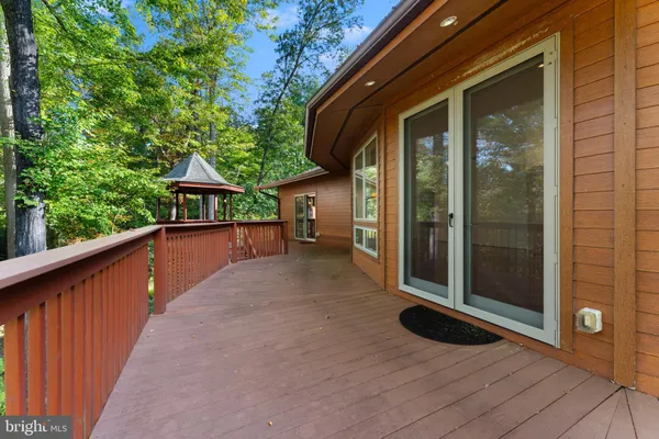 a view of a house with porch and wooden floor