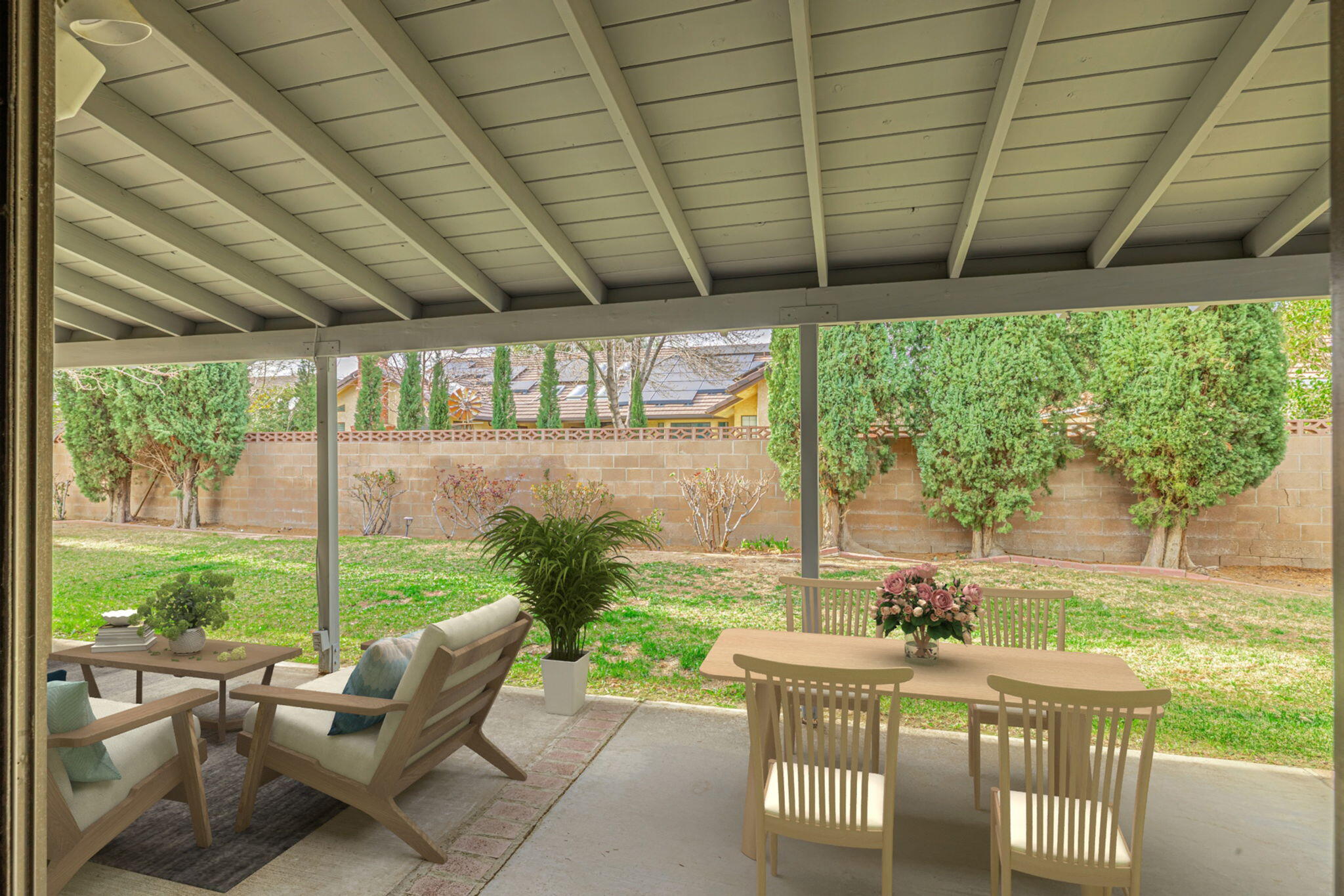 431 Fantasy Street Palmdale, CA 93551 - Photo 12 of 24 a view of a patio with table and chairs and potted plants