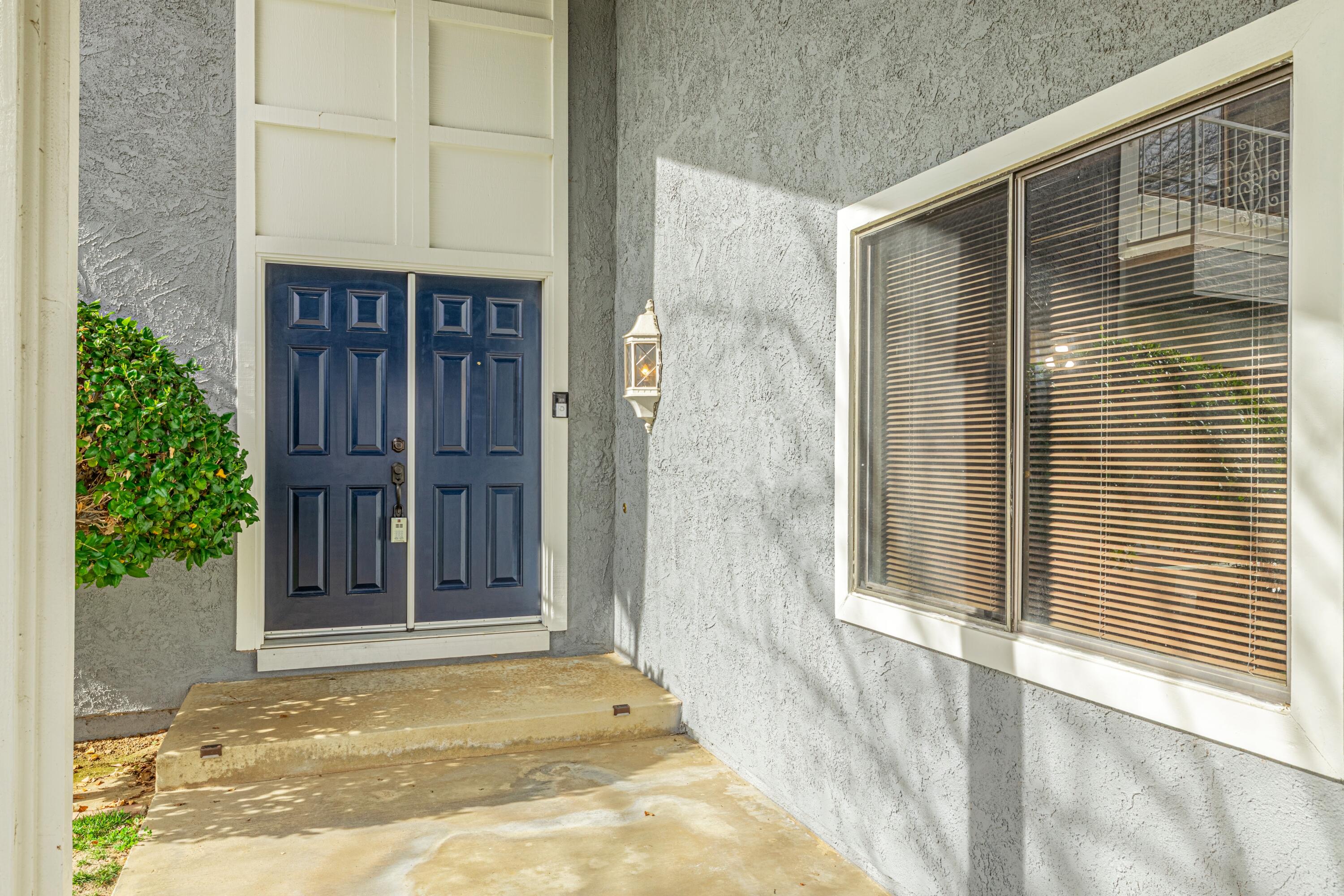 431 Fantasy Street Palmdale, CA 93551 - Photo 13 of 24 a view of a wooden door of the house