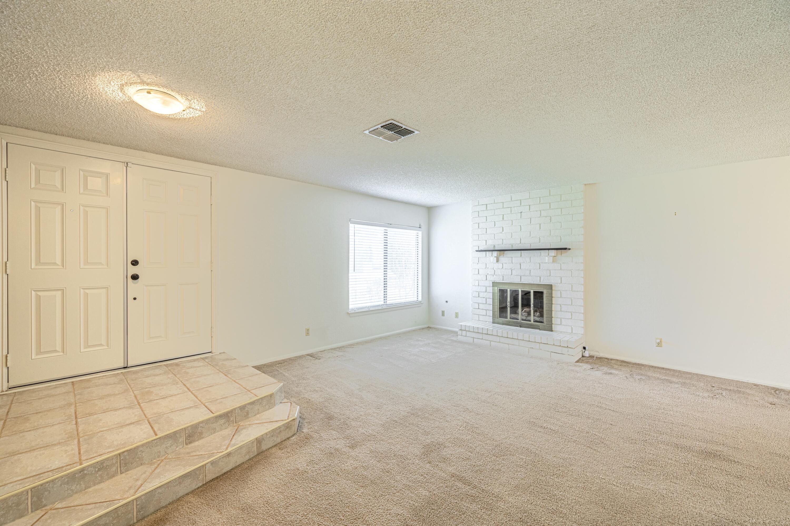 431 Fantasy Street Palmdale, CA 93551 - Photo 22 of 24 a view of empty room with a fireplace