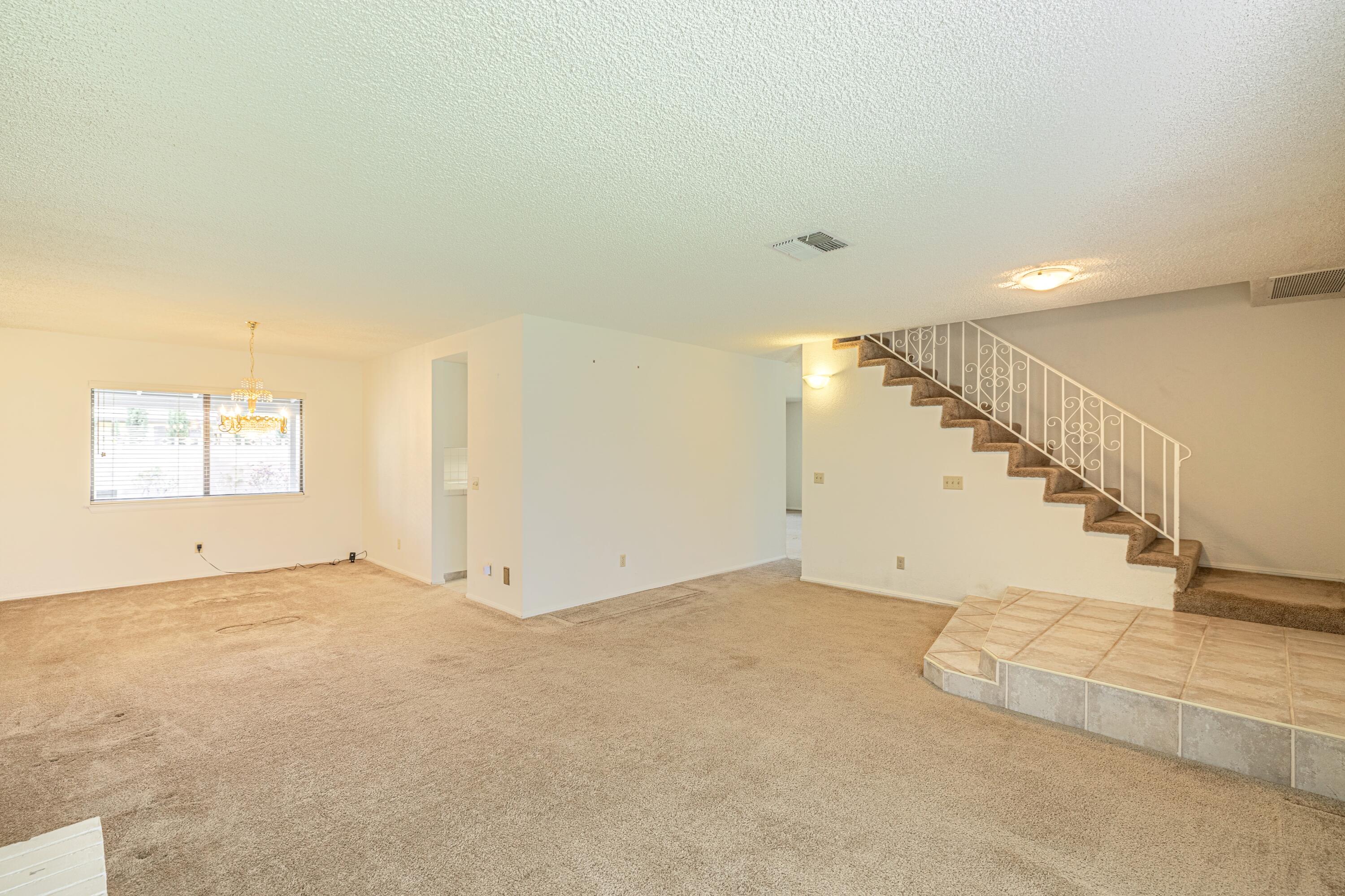 431 Fantasy Street Palmdale, CA 93551 - Photo 24 of 24 a view of an empty room with stairs