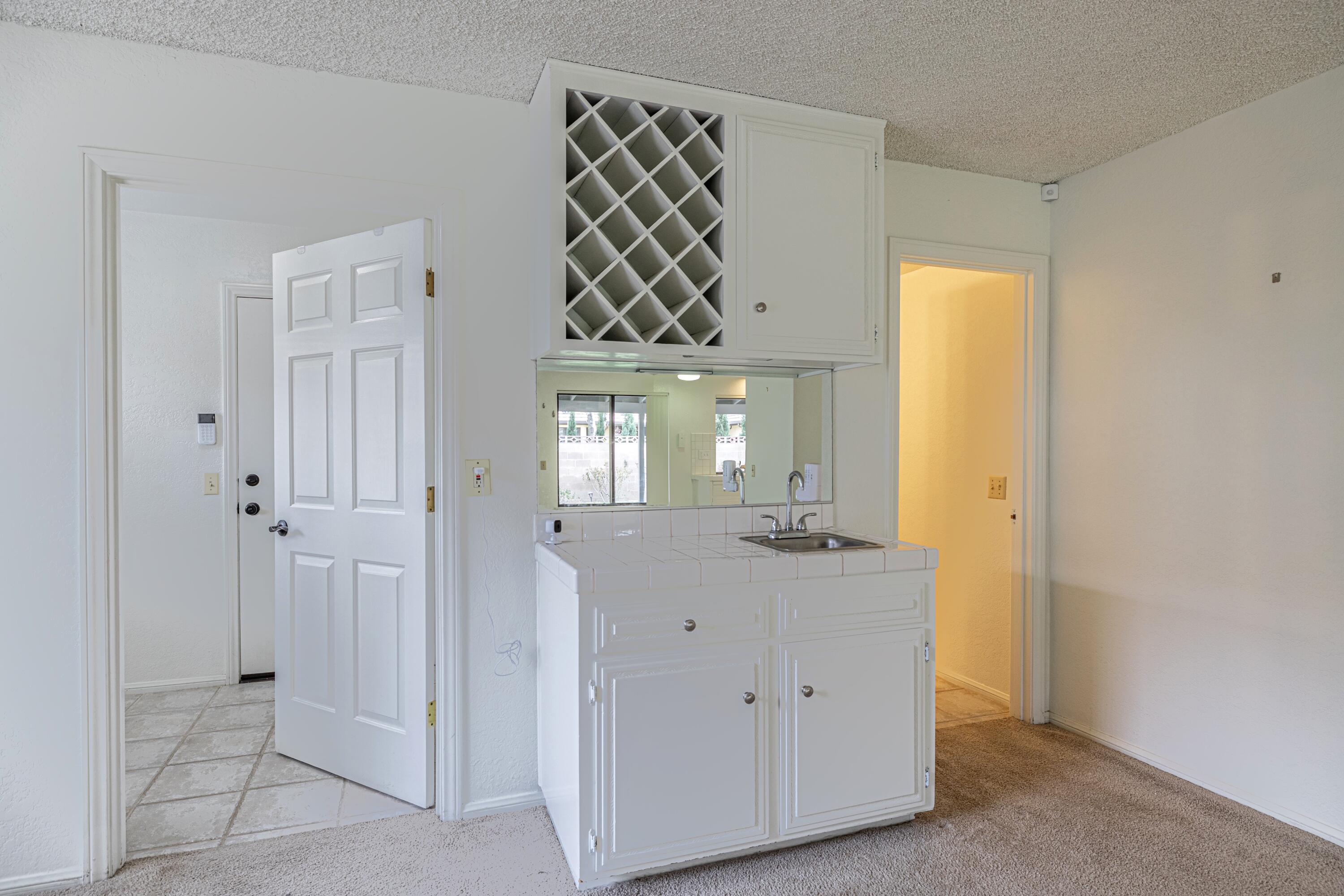 431 Fantasy Street Palmdale, CA 93551 - Photo 4 of 24 a view of a bathroom with a sink and a mirror
