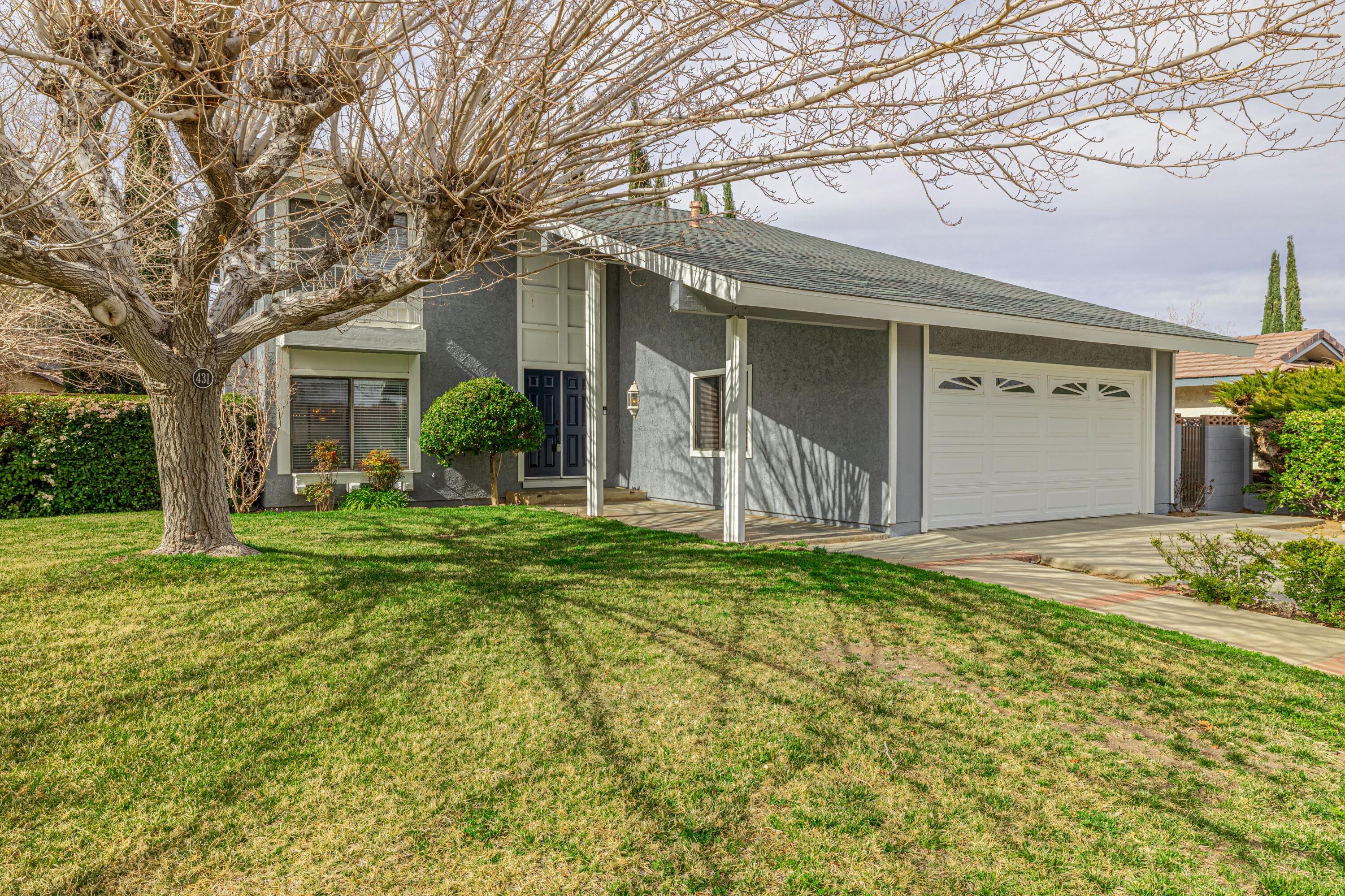 431 Fantasy Street Palmdale, CA 93551 - Photo 10 of 24 front view of a house with a yard