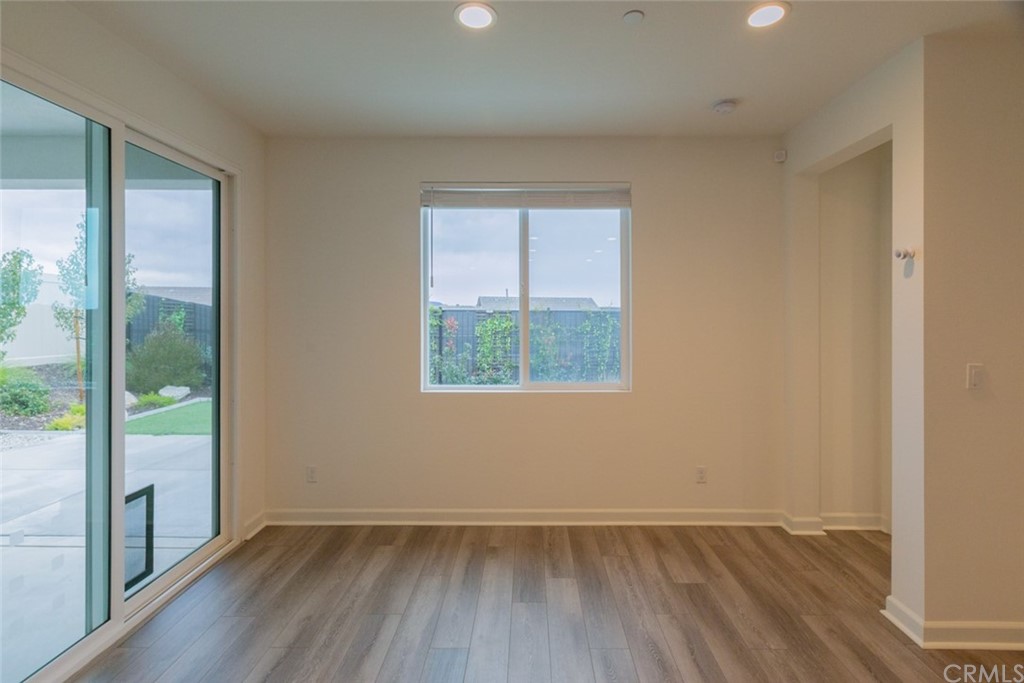 32151 Everview Temecula, CA 92591 - Photo 12 of 29 an empty room with wooden floor and windows