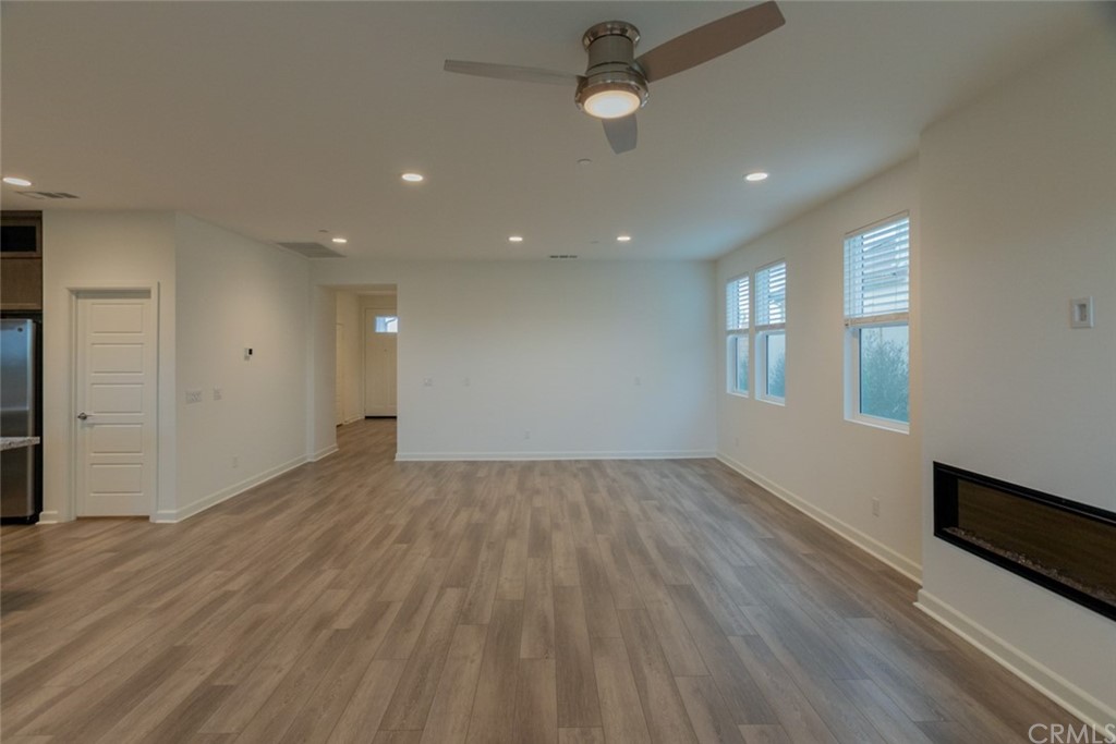 32151 Everview Temecula, CA 92591 - Photo 13 of 29 an empty room with wooden floor and windows