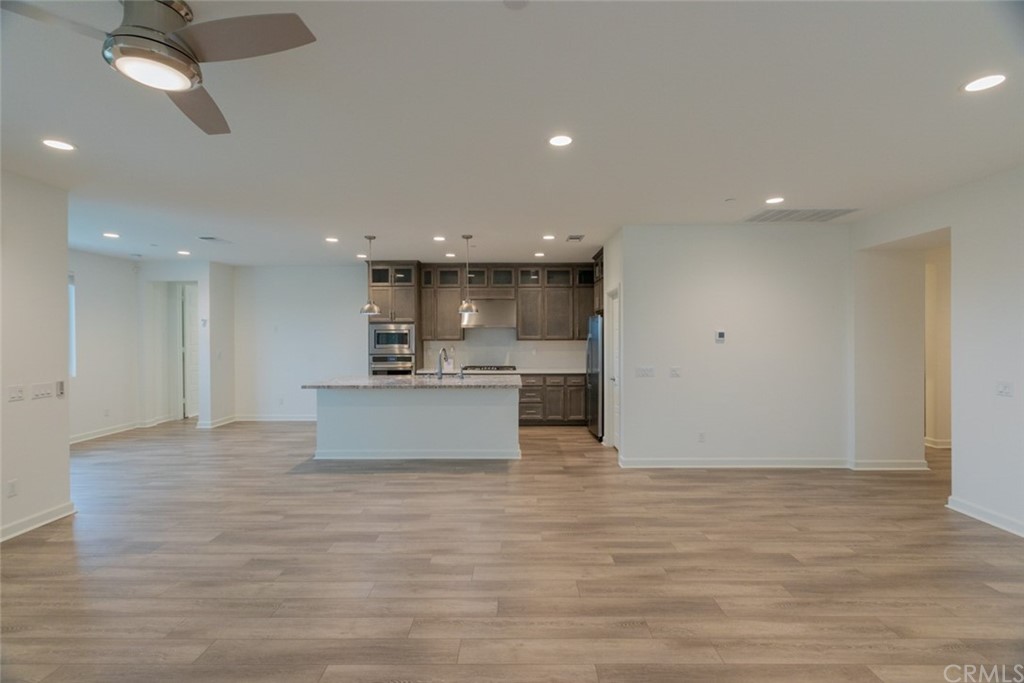 32151 Everview Temecula, CA 92591 - Photo 14 of 29 a view of kitchen and kitchen with stainless steel appliances granite countertop cabinets
