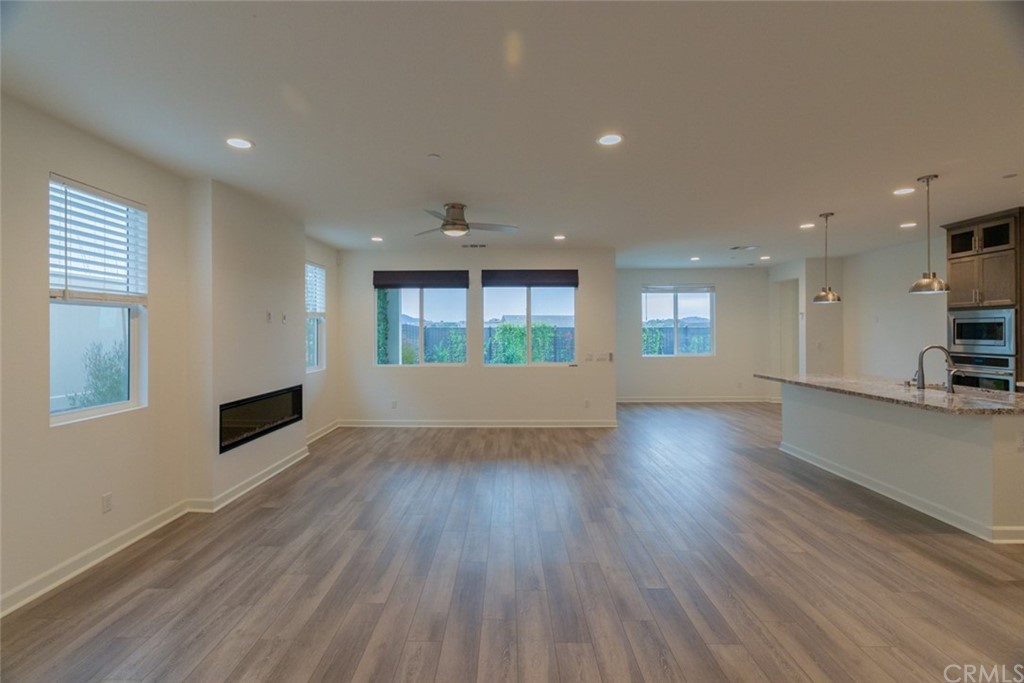 32151 Everview Temecula, CA 92591 - Photo 15 of 29 an empty room with wooden floor and windows