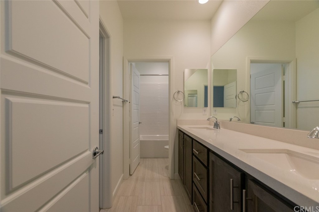 32151 Everview Temecula, CA 92591 - Photo 18 of 29 a spacious bathroom with a double vanity sink a and mirror