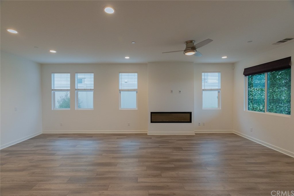 32151 Everview Temecula, CA 92591 - Photo 5 of 29 an empty room with wooden floor and windows