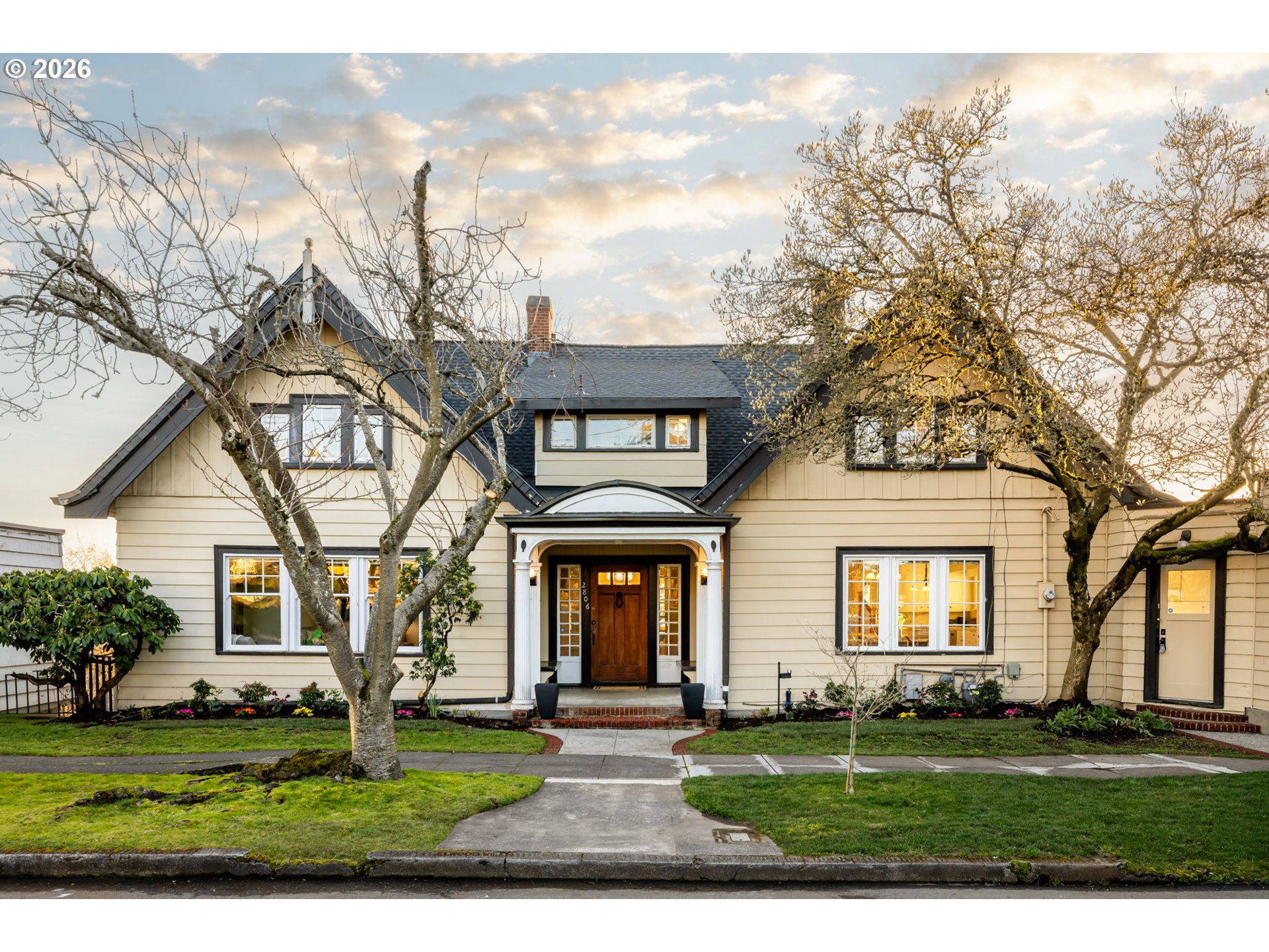 2806 Northeast Alameda Street Portland, OR 97212 - Photo 1 of 45 a front view of a house with a garden and trees