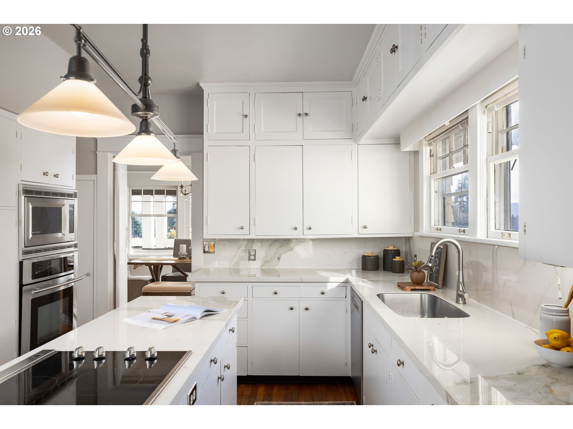 2806 Northeast Alameda Street Portland, OR 97212 - Photo 14 of 45 a kitchen that has a lot of white cabinets and stainless steel appliances