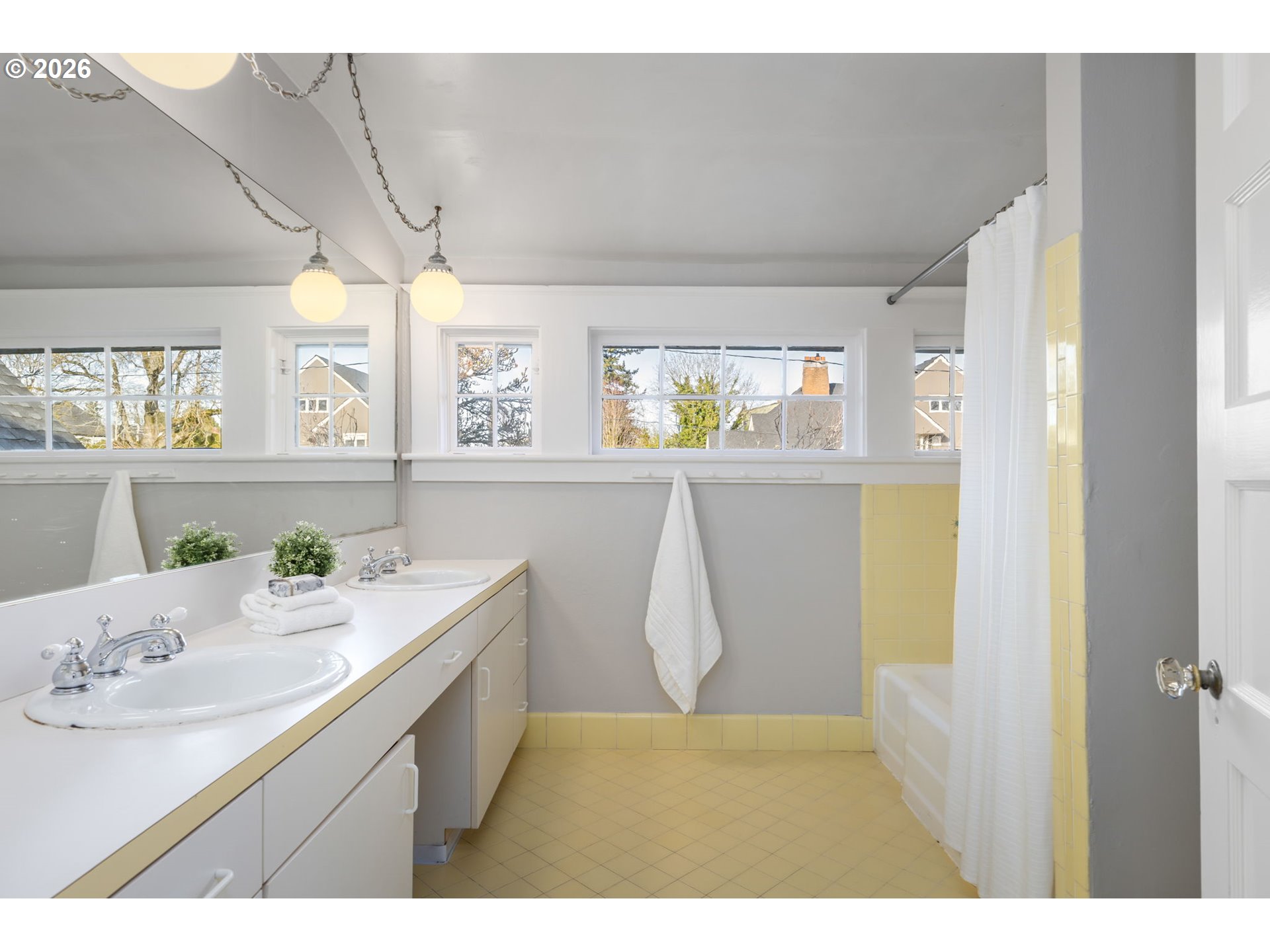 2806 Northeast Alameda Street Portland, OR 97212 - Photo 30 of 45 a bathroom with a sink a mirror and a bathtub