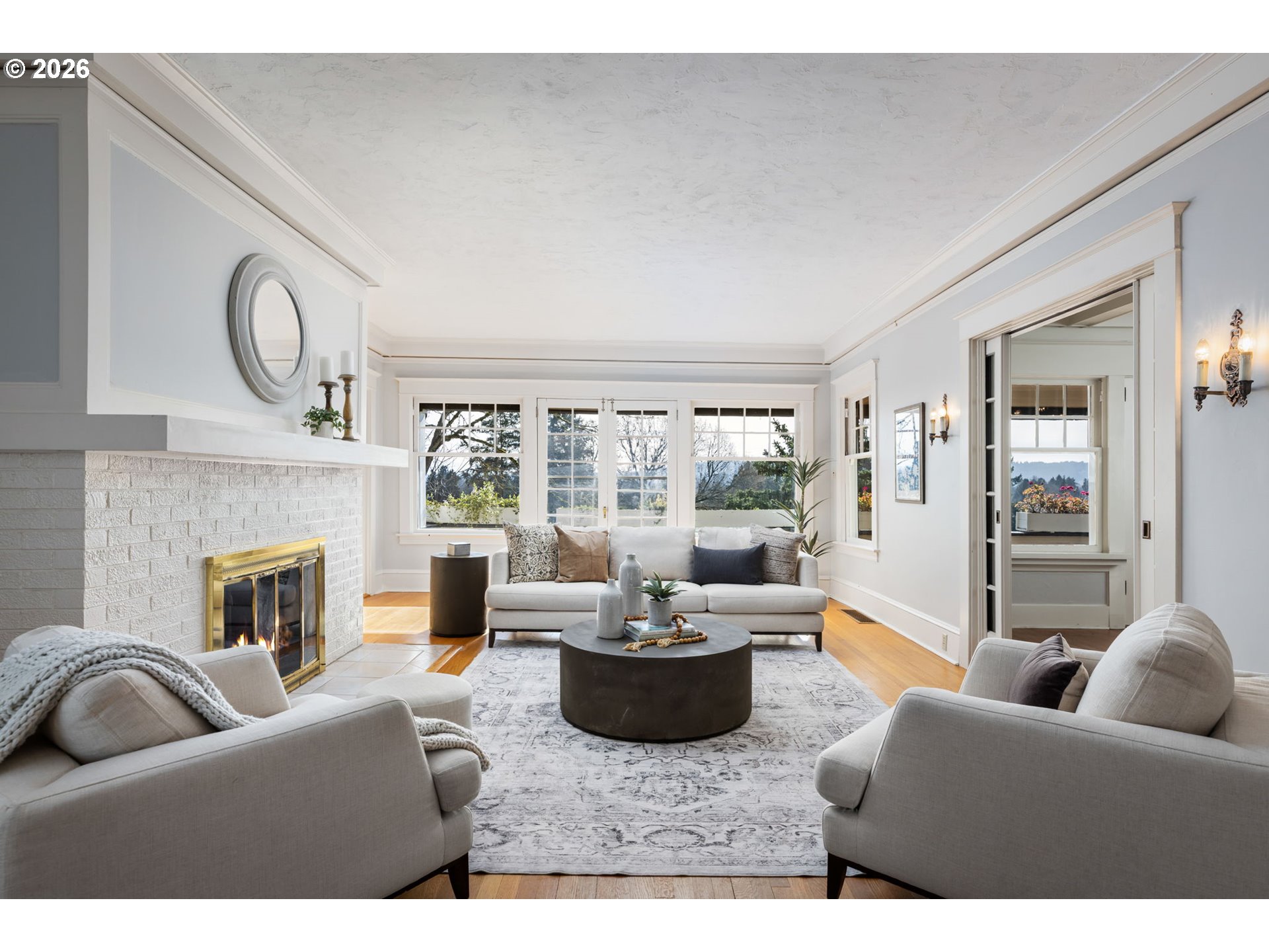 2806 Northeast Alameda Street Portland, OR 97212 - Photo 5 of 45 a living room with furniture a fireplace and a large window