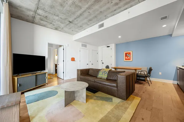 a living room with furniture and a flat screen tv