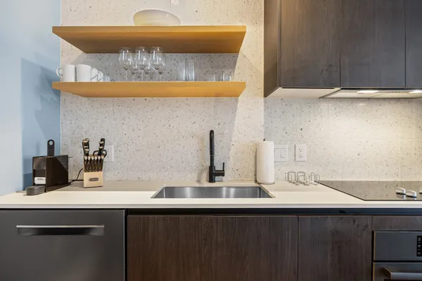 a kitchen with a sink and cabinets